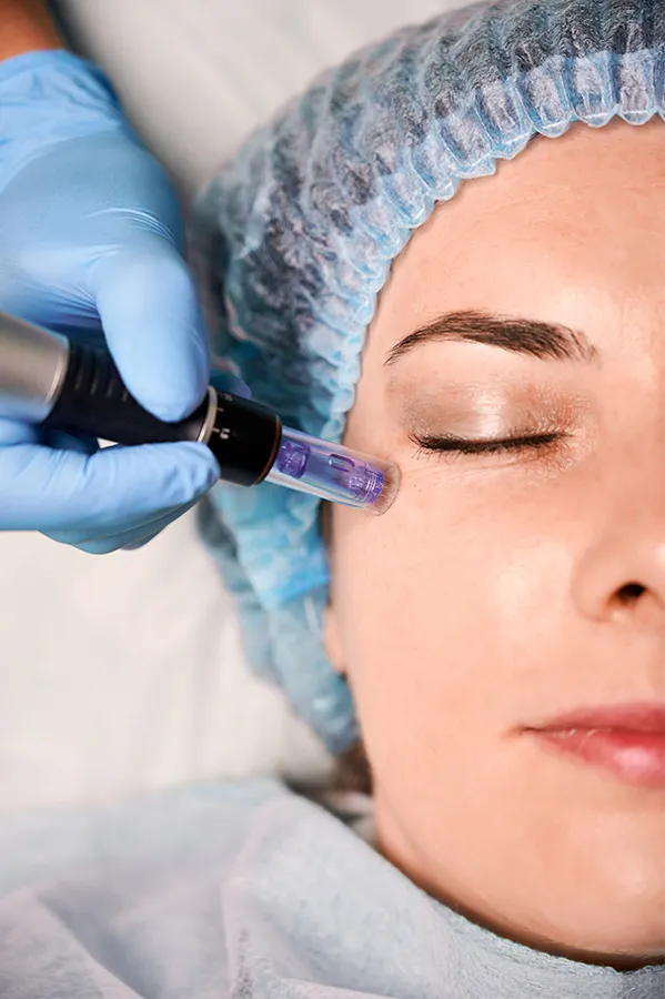 Glow-Peptide-Therapy-Treatment A woman receiving peptide therapy to her face. Get GLOW peptides for Skin and Aesthetics from Audra Foster, N.D. of Epic Living Medical Center in Pleasanton, California.